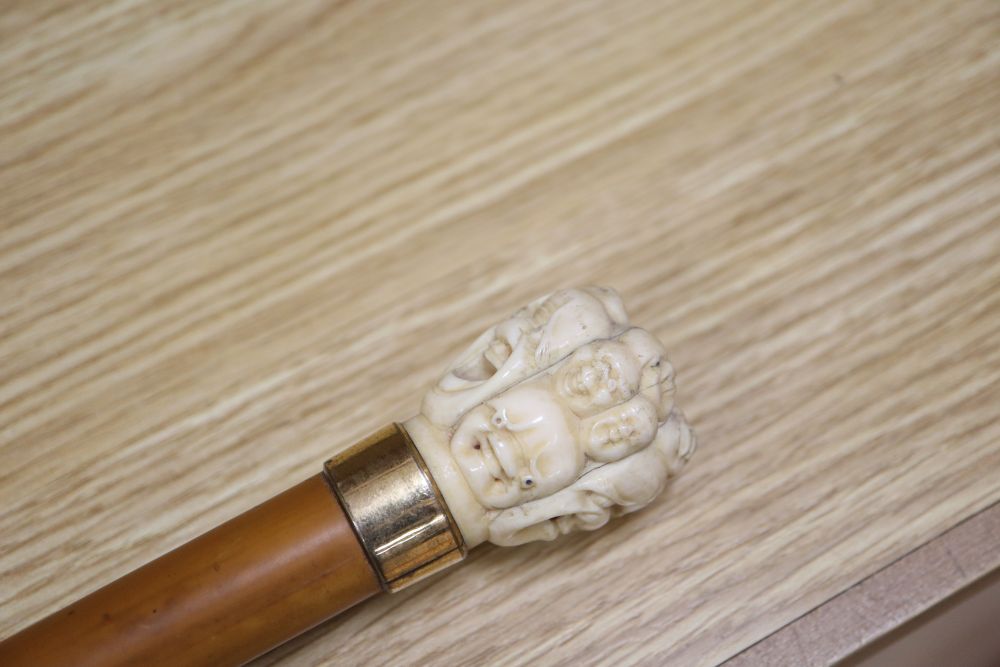 An umbrella with a carved Chinese ivory handle, c.1900, length 73cm